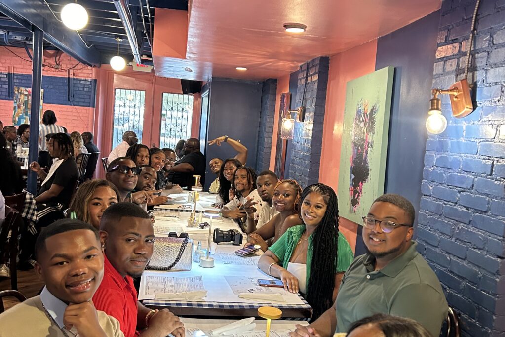 Cricket Wireless HBCU students at a group dinner at a restaurant