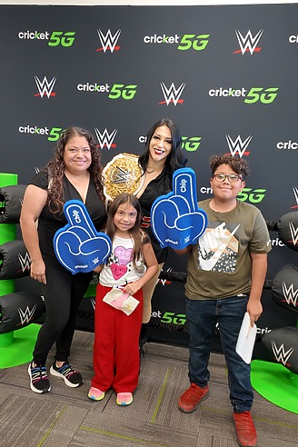 WWE Superstar with fans holding number one foam hands