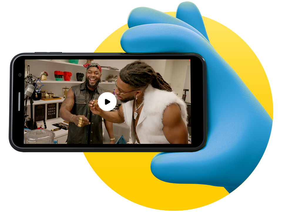 Character holding phone watching the episode of with Johnny Nelson Jewelry and Trick William